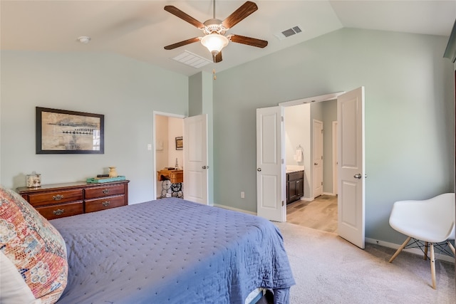 carpeted bedroom with ensuite bath, vaulted ceiling, and ceiling fan