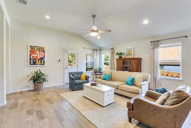 living room with vaulted ceiling, light hardwood / wood-style flooring, and ceiling fan