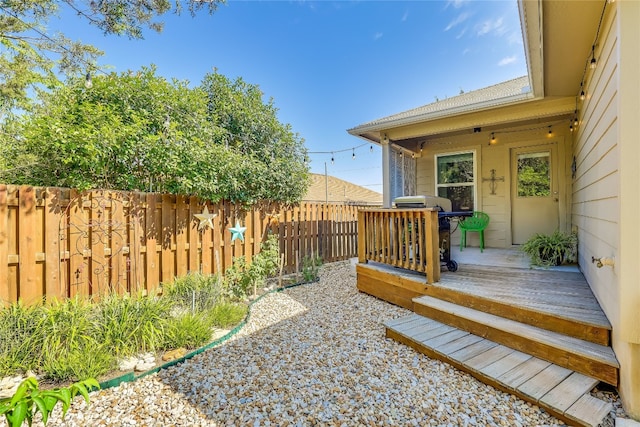 view of yard featuring a deck and a patio area