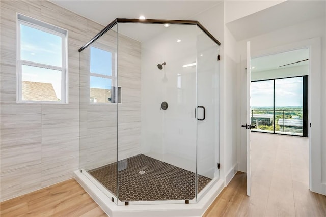 15000 Texas St, Austin, TX 78734 - bathroom featuring a stall shower and wood finished floors