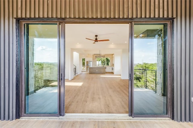 15000 Texas St, Austin, TX 78734 - entryway with wallpapered walls, ceiling fan, and wood finished floors