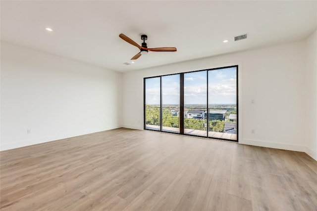 15000 Texas St, Austin, TX 78734 - unfurnished room featuring ceiling fan, light wood-style floors, baseboards, and recessed lighting