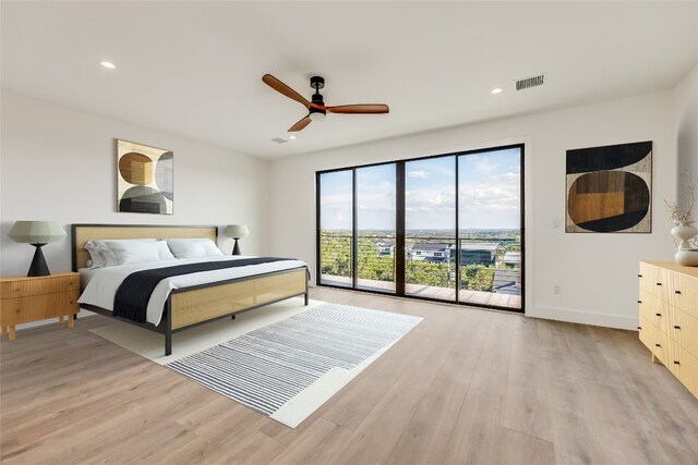 bedroom with access to exterior, ceiling fan, and light wood-type flooring