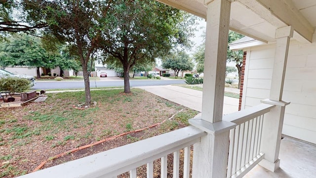 view of yard featuring covered porch