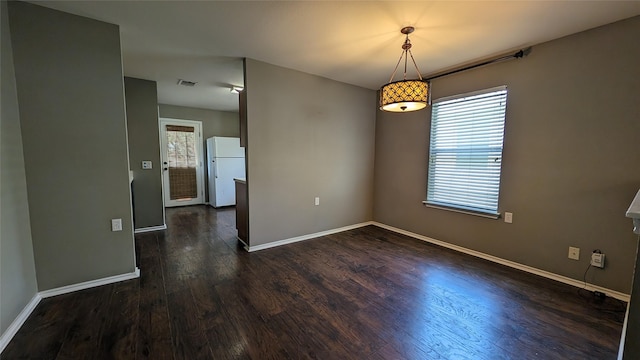 unfurnished room featuring dark hardwood / wood-style floors