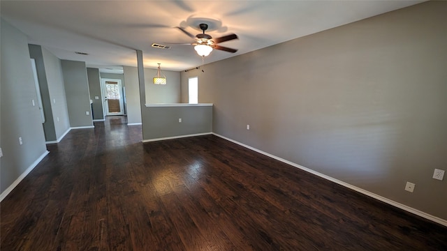 spare room featuring ceiling fan and dark hardwood / wood-style flooring