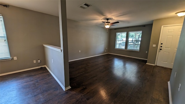 spare room featuring ceiling fan and dark hardwood / wood-style flooring