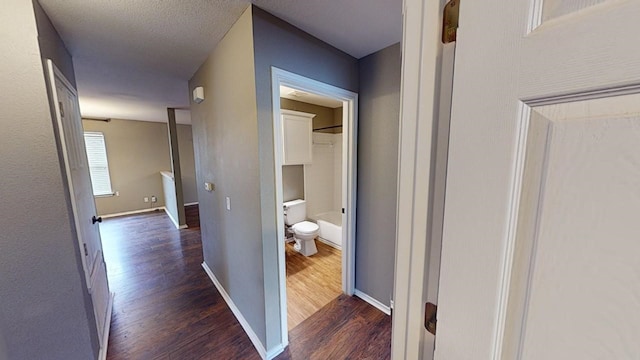 hall with dark wood-type flooring