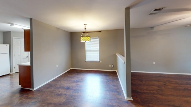 spare room with dark wood-type flooring