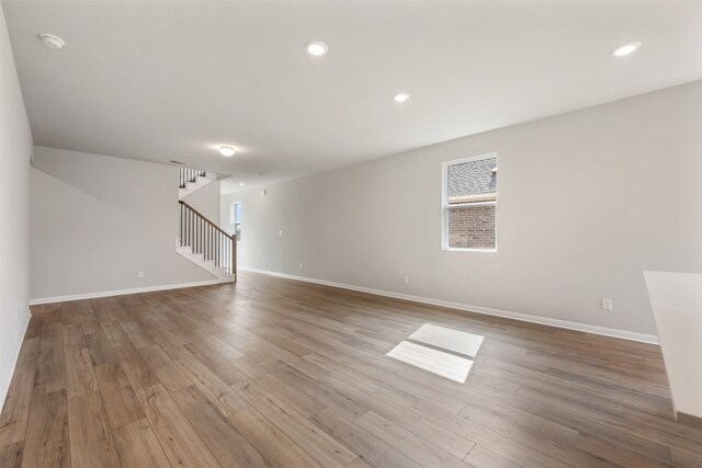 unfurnished room featuring hardwood / wood-style flooring