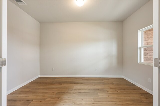 unfurnished room featuring light hardwood / wood-style flooring