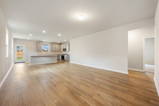 unfurnished living room featuring light hardwood / wood-style flooring