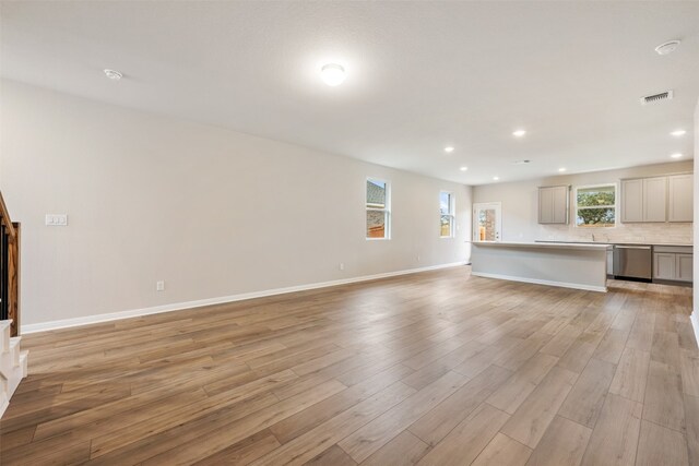 unfurnished living room with light wood-type flooring