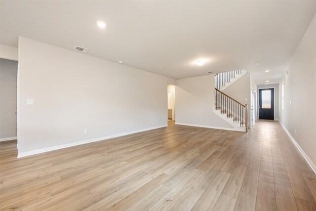 spare room with light hardwood / wood-style floors