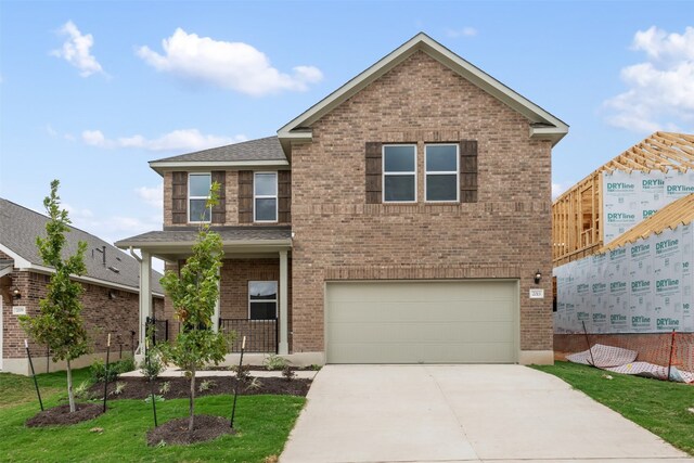 front of property with a garage