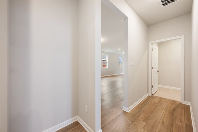 corridor featuring light wood-type flooring