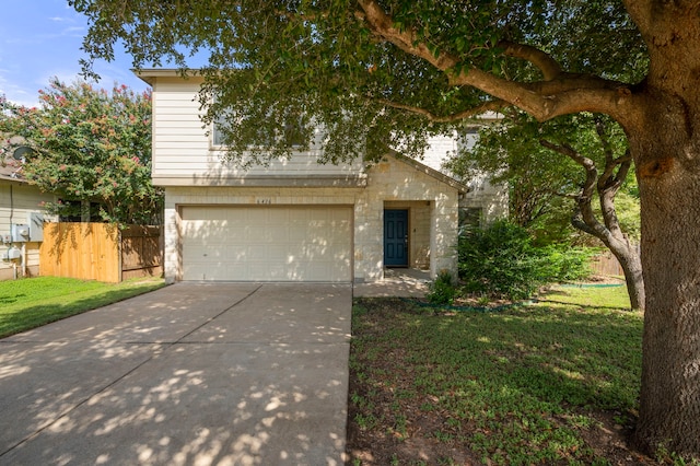 view of front of house with a front lawn and a garage