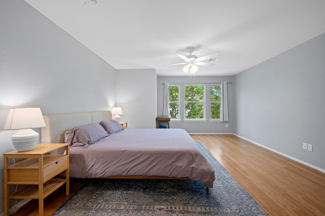 bedroom featuring ceiling fan and hardwood / wood-style floors