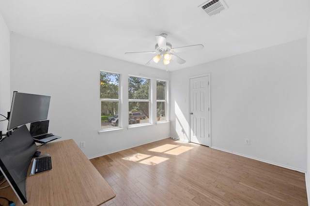 office area with ceiling fan and light hardwood / wood-style floors