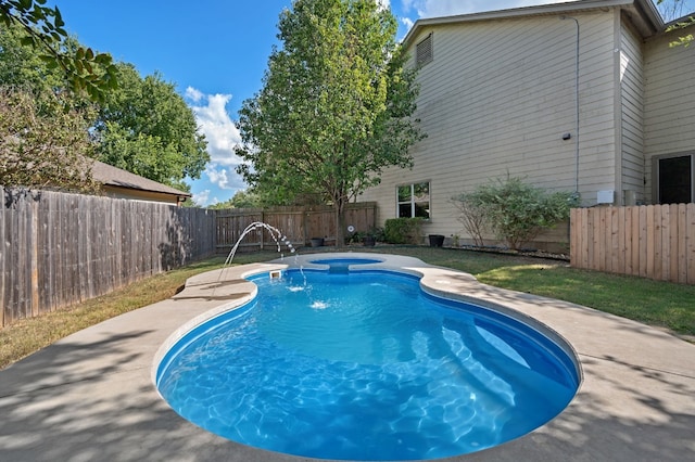 view of swimming pool with an in ground hot tub and pool water feature