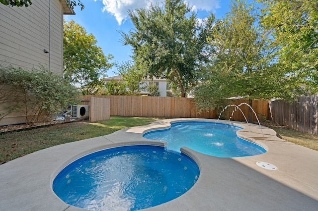 view of swimming pool featuring pool water feature and a patio