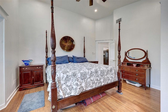 bedroom featuring light hardwood / wood-style floors and ceiling fan