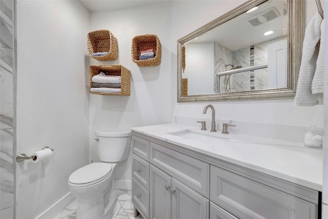 bathroom with vanity, toilet, and a shower with shower door