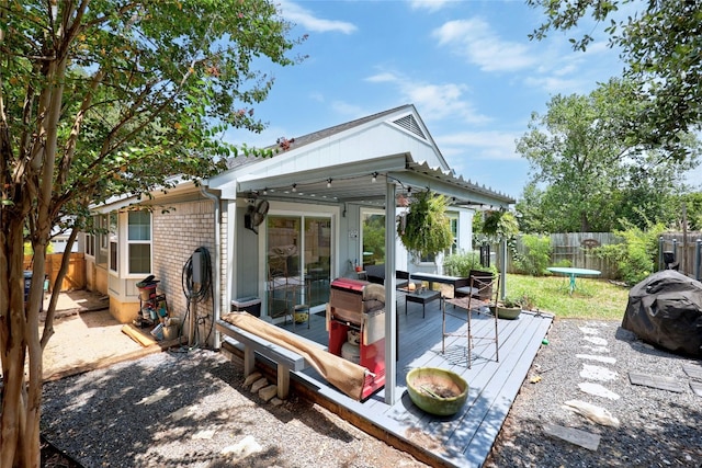 back of property featuring a wooden deck