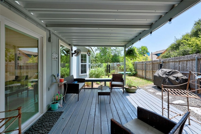 wooden deck with a grill