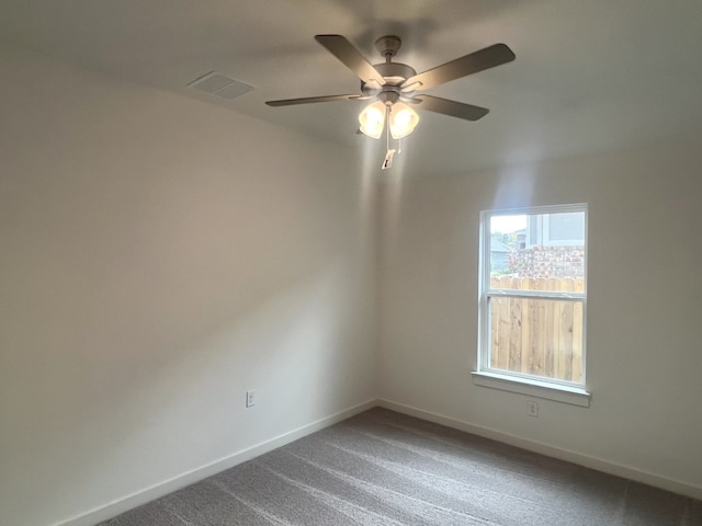 spare room with carpet floors and ceiling fan