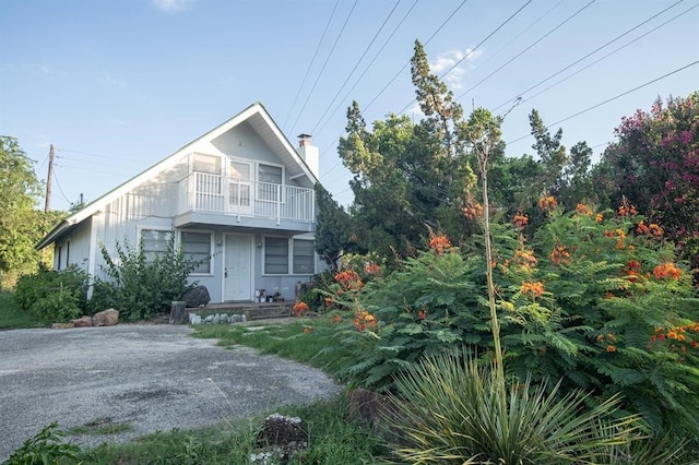 view of front of home with a balcony