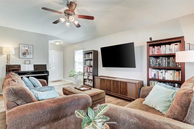 living room with light wood-type flooring and ceiling fan