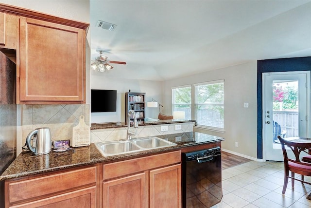 kitchen with ceiling fan, decorative backsplash, sink, black dishwasher, and light hardwood / wood-style flooring