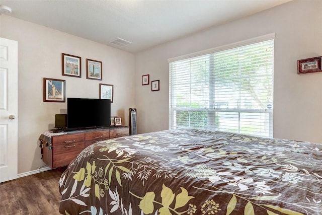 bedroom featuring dark wood-type flooring