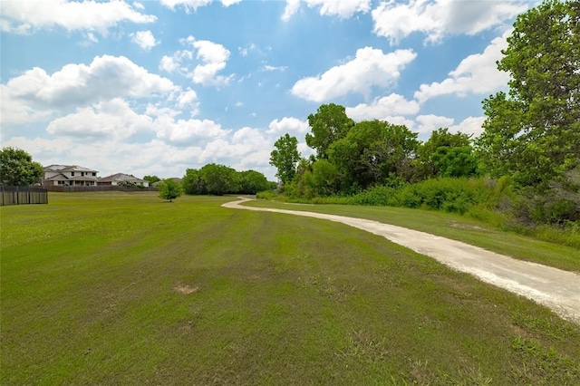 view of property's community with a yard