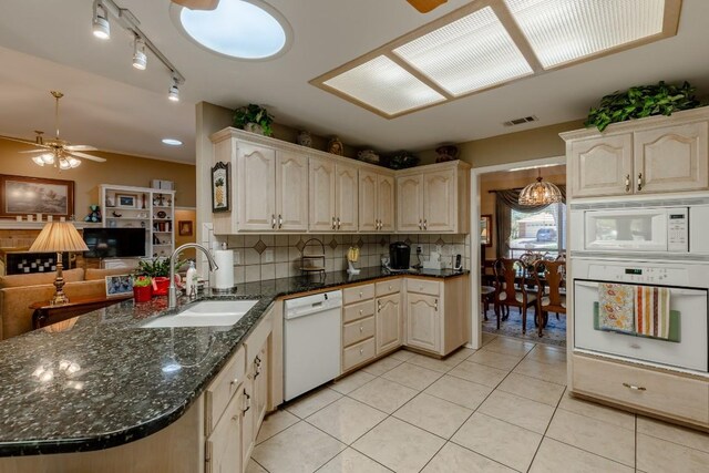 kitchen with light tile patterned flooring, sink, ceiling fan, and white appliances