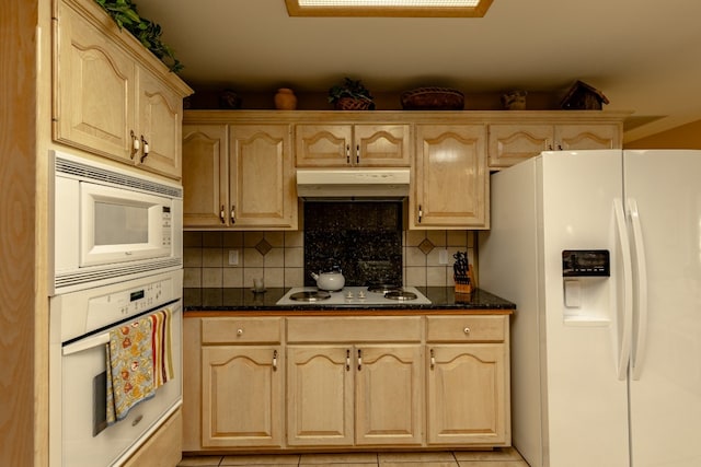 kitchen with tasteful backsplash, light brown cabinets, white appliances, and light tile patterned floors