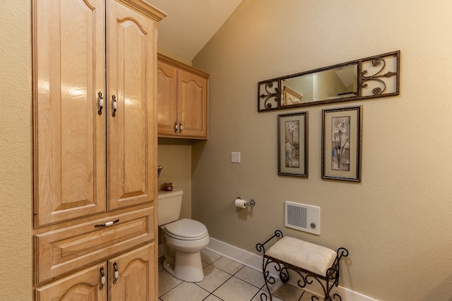 bathroom with tile patterned floors and toilet