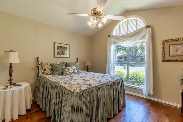 bedroom with vaulted ceiling, dark hardwood / wood-style floors, and ceiling fan