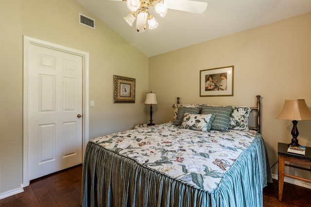 bedroom featuring lofted ceiling, ceiling fan, and dark wood-type flooring