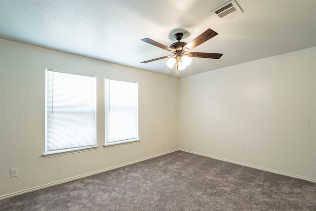 empty room with carpet floors and ceiling fan