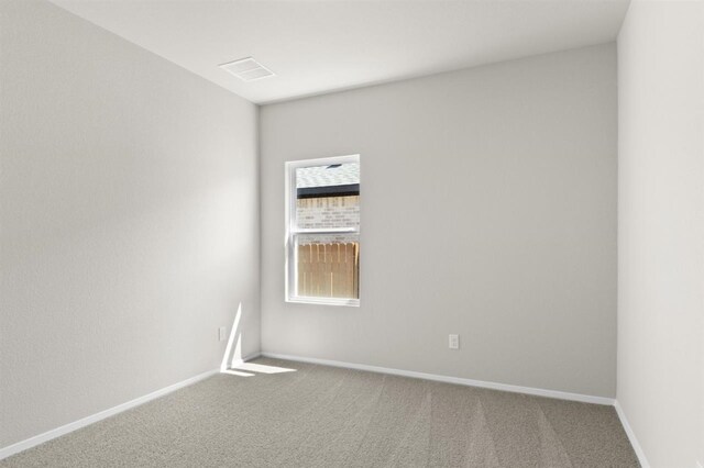 unfurnished room featuring carpet flooring