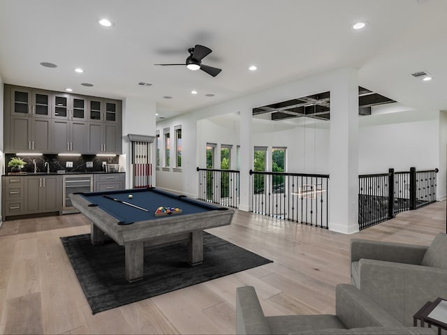 game room featuring pool table, light hardwood / wood-style flooring, beverage cooler, and ceiling fan