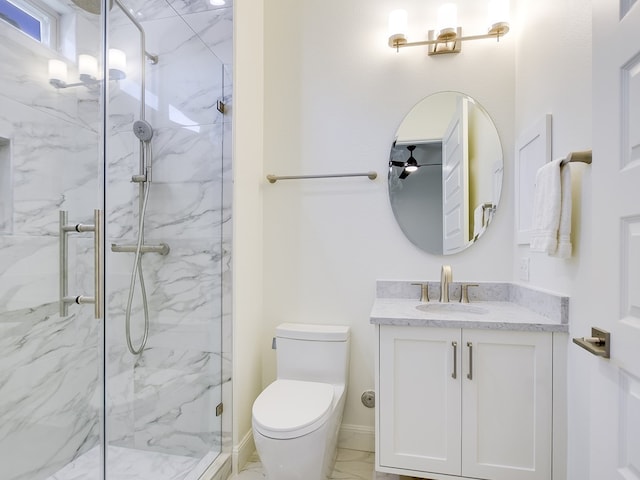 bathroom featuring vanity, an enclosed shower, and toilet