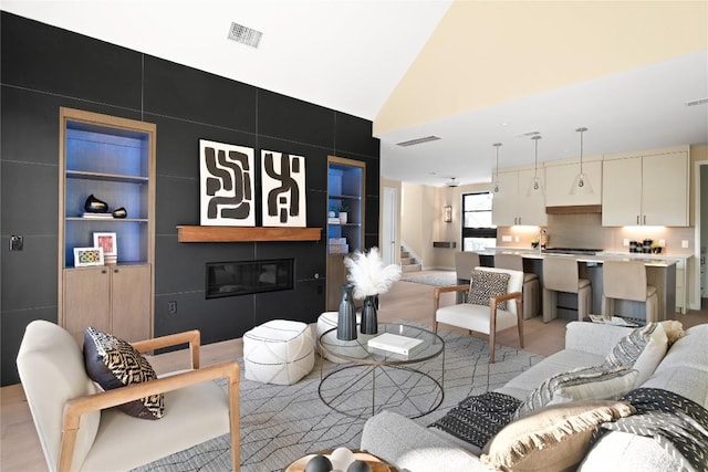 living room featuring vaulted ceiling