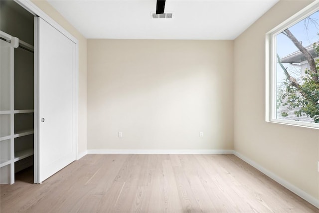 unfurnished bedroom featuring light wood-type flooring