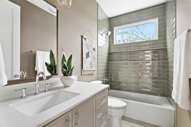 full bathroom with vanity, toilet, and tiled shower / bath combo