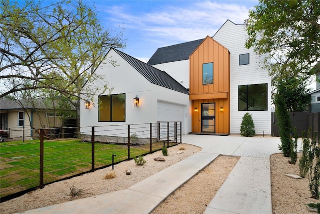 view of front of house with a garage and a front yard