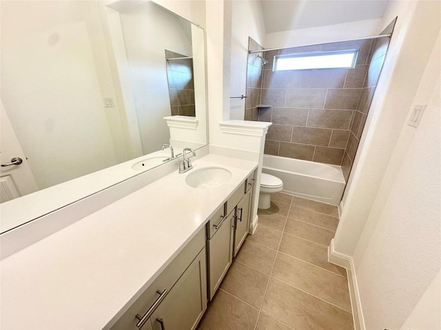 full bath with washtub / shower combination, toilet, vanity, and tile patterned flooring