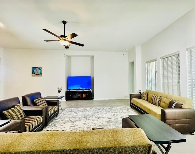 living room with hardwood / wood-style flooring and ceiling fan